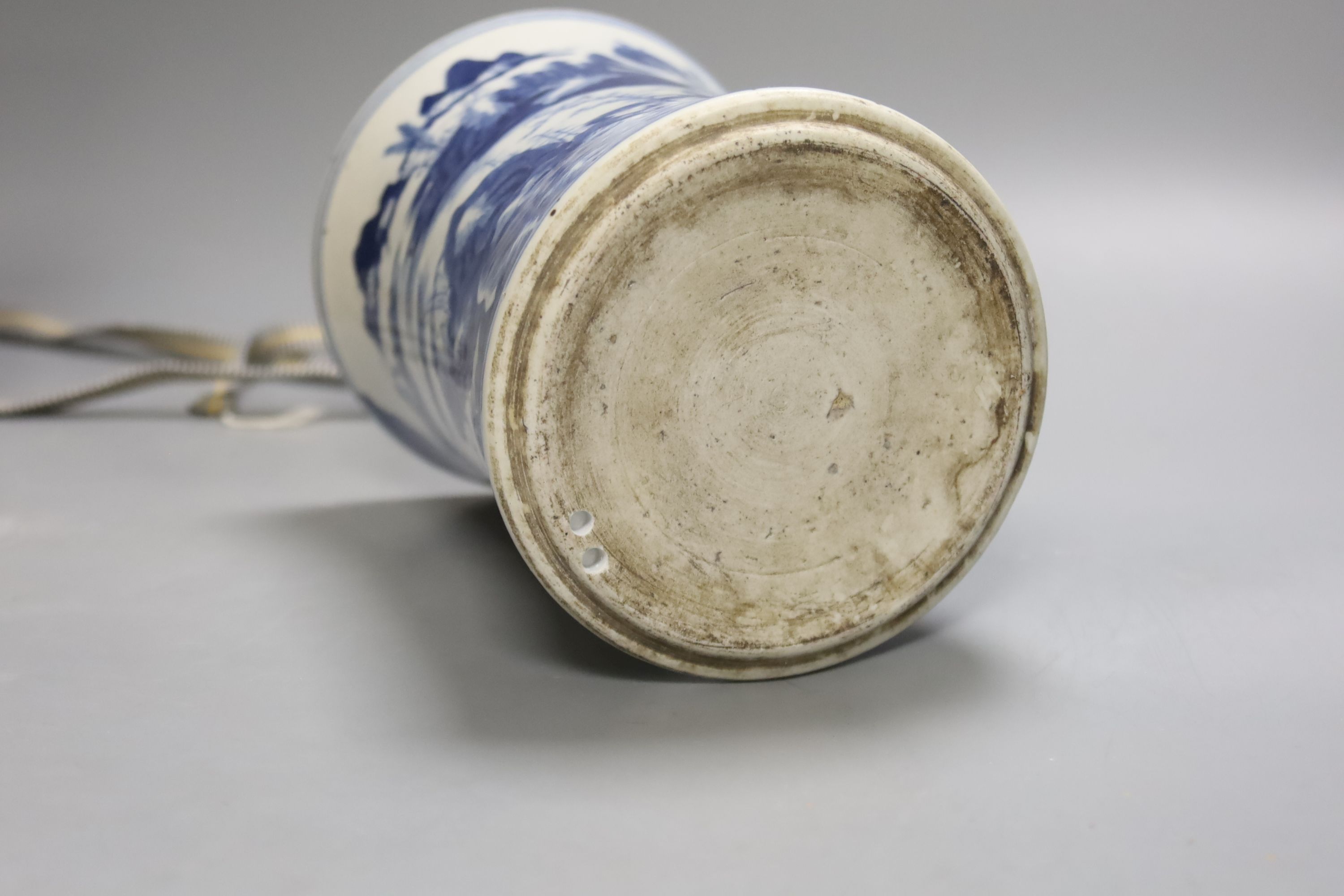 A Chinese blue and white porcelain brush pot, painted with a landscape, 17cm high, in later pine box